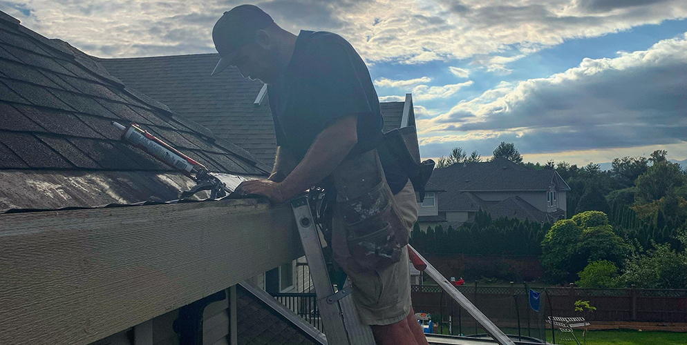 RMJ Property Services inspecting gutters